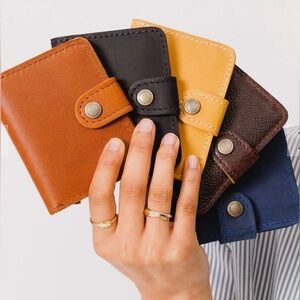PORTLAND LEATHER GOODS MINI BIFOLD WALLET IN TURMERIC.